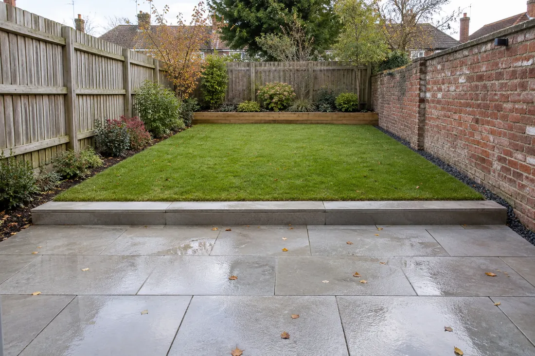 Finished garden with porcelain patio, lawn and planted beds